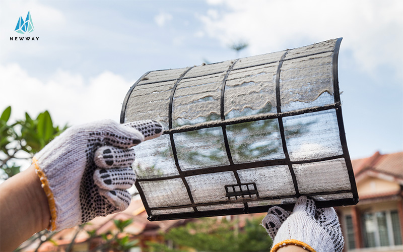 A Person Removing Dirty Air Filters