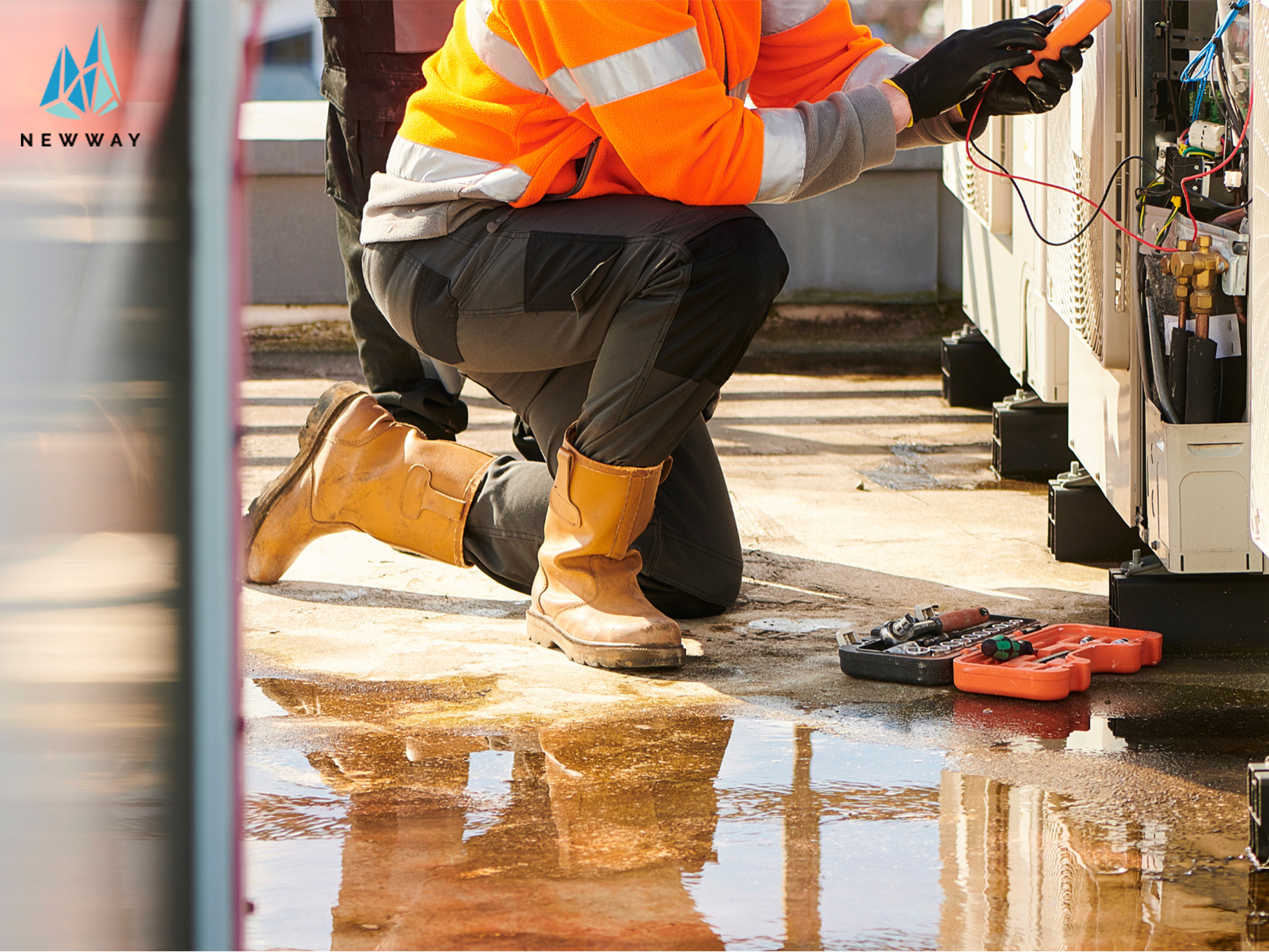 Image of an air conditioning condenser being fixed due to leaking